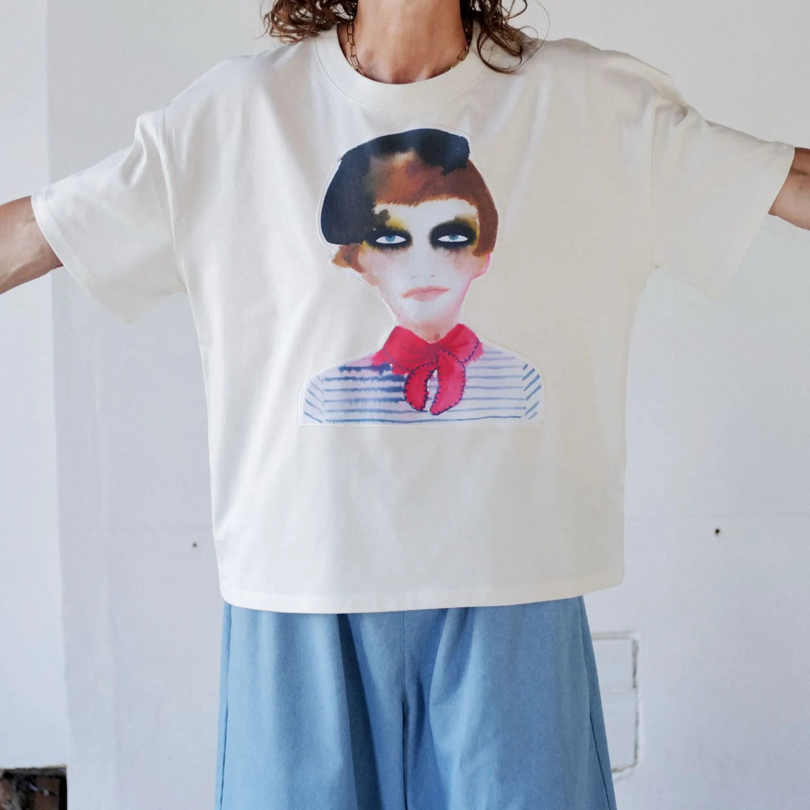 Inky Face applique tee shirt, a watercolour portrait of a face in a beret and red neck scarf, at Edy and Bridge