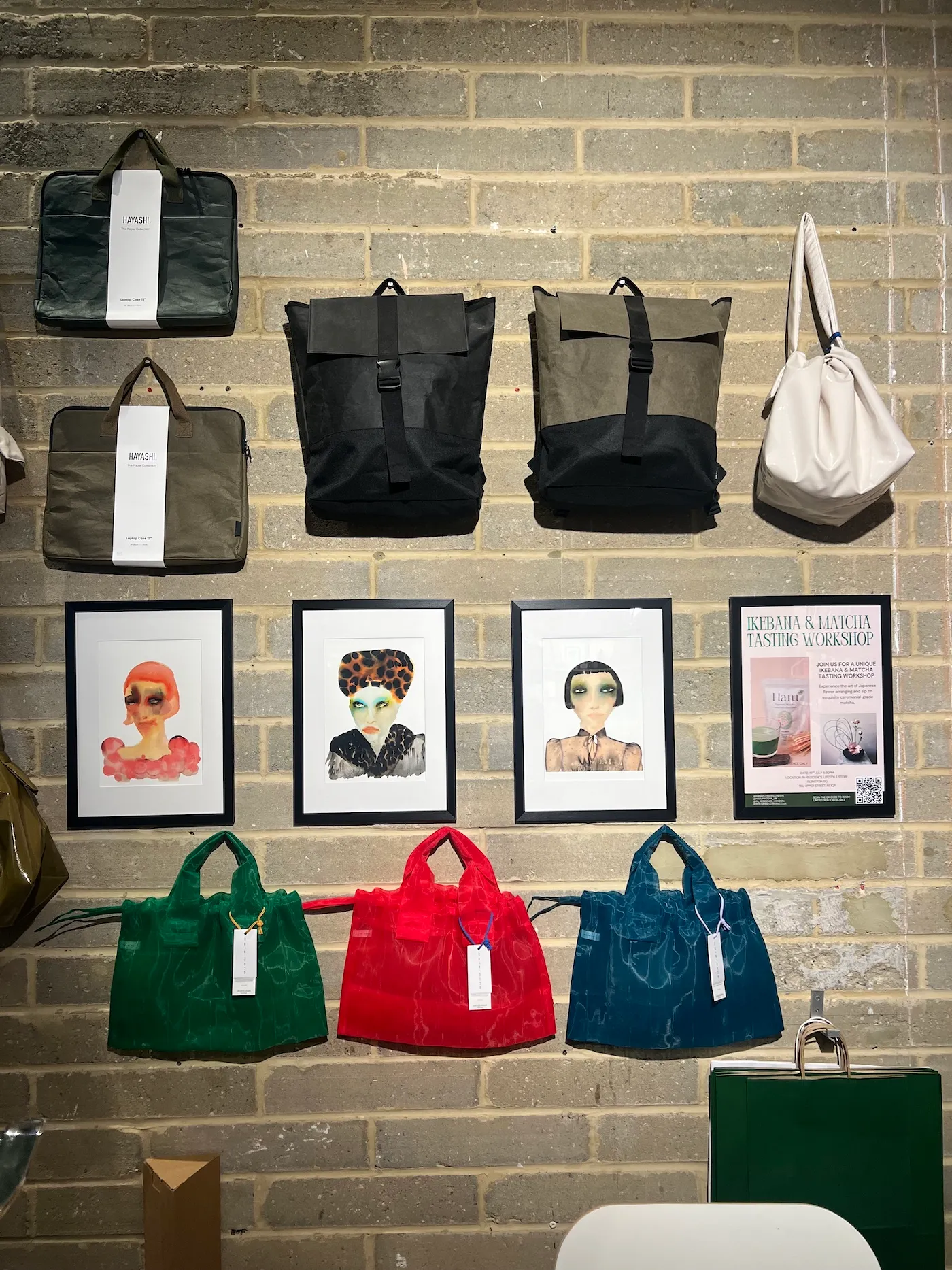 Tracey Smith Inky Faces watercolour ink prints displayed in store.